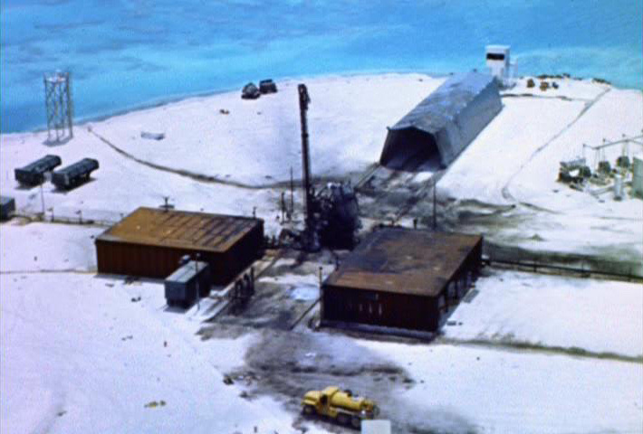 Johnston Island's Thor launch pad from the air, with the burned gantry and blackened ground after the Bluegill Prime explosion