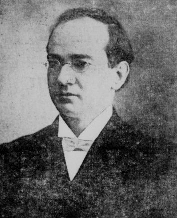 A grainy newspaper half-tone portrait of a clean-shaven man of about forty-five in pince-nez spectacles, a high collar and a dark coat, looking to the left